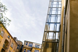 Outdoor domestic elevator in glass shaft, 4 persons, 4 stations, Prague 6